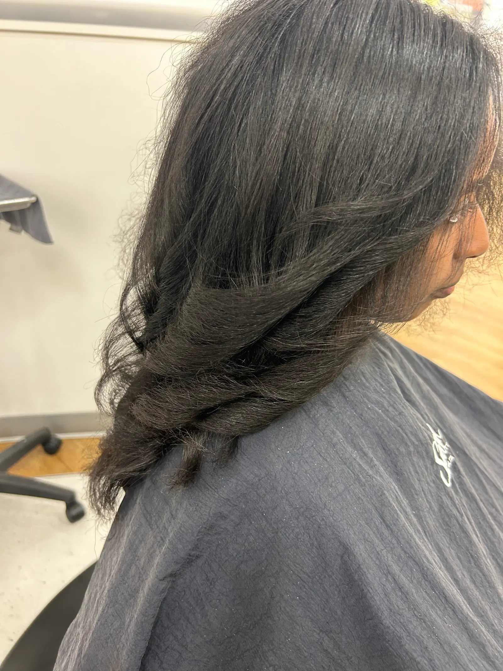 Long dark hair styled in loose waves